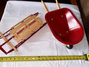 lot 13 image: Radio Flyer Miniature Sled and Wheel Barrell Toys