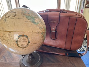 lot 102 image: Vintage Globe and Unicorn Suitcase