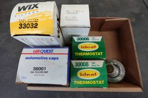 lot 136 image: Assorted Thermostats and Filler Caps