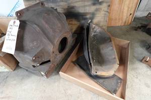lot 150 image: NOS Bell Housing and Splash Plate for 6 Cylinder Chevrolet Truck