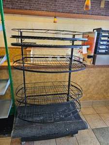 lot 13 image: Multi-tiered Metal Display Rack with Wired Shelves