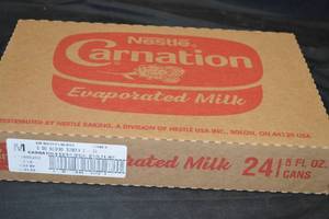 lot 315 image: Nestle Carnation Evaporated Milk 24 X 5 fl oz Cans Best by 01262024