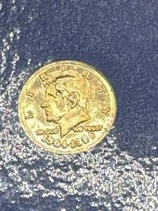 lot 10 image: Solid 14kt Gold JFK Coin (9mm)