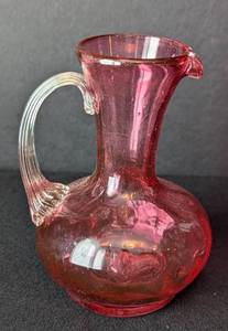 lot 37 image: Two Cranberry Glass Pitchers