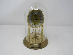 lot 66 image: Gold clock in cloche