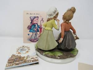 lot 75 image: Two women porcelain statue and 2 post cards and village booklet