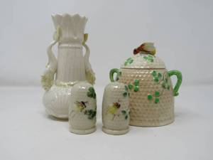 lot 77 image: Enchant Your Table with Vintage Irish Belleek Charm (4 Pieces) pieces saltpepper shakers, honey pit with belleek, cream vase