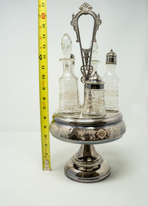 lot 18 image: Elegance Awaits - Antique Victorian Silver Plate Caster Cruet set of 5 bottles and holder--complete set