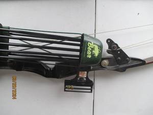lot 41 image: Vintage Bear Archery Recurve Bow and Arrows Set