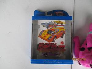 lot 66 image: Assorted Collectible Lot Hot Wheels Rodger Dodger, Animated Character Figures, and Plush Toy