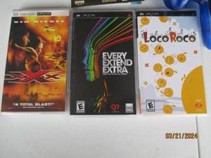 lot 87 image: Assorted PSP Games and Soundtrack with Third-Party Game Controller