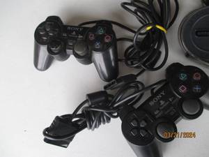 lot 104 image: Sony PlayStation Controllers and Extension Cable Bundle