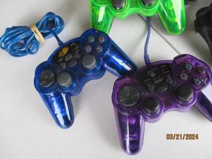 lot 105 image: Assorted PlayStation Compatible Controllers Lot