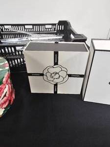 lot 231 image: 2 Round Hat Boxes, 2 Chanel Perfume Boxes, Crate and Hangers