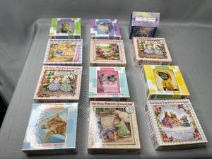lot 65 image: Twelve Mini 100 Pc Puzzles, Cats, Bunnies & Thomas Kinkade (number of pieces unverified)
