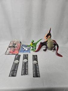 lot 154 image: Misc Toy Lot Inc Statue of Liberty Watches in Manufacturing Pkg, Sons of Anarchy Clay in Manufacturing Pkg, Sky Wings Die Cast Metal Plane in Pkg, 2 Plastic Dinosaurs