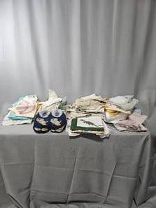 lot 211 image: Table Linens, 2 Pair of Slippers w Tags, Place Mats, Napkins, Towels, Doilies