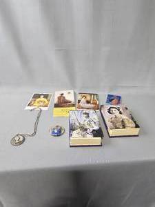 lot 214 image: Queen Elizabeth Post Cards & Note Books, New Zealand Commemorative Dollar on Chain, Prince CharlesPrincess Di Pin