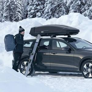 lot 15 image: Thule Convoy Rectangle-Shaped Roof Top Cargo Box, Lockable, Large, Black like new. $729.99