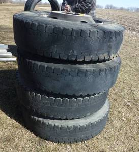 Four 11R22.5 virgin semi tires with Rims