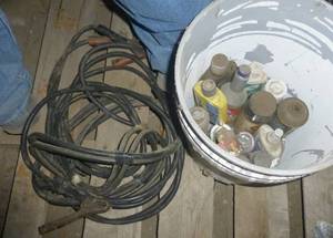 jumper cables and bucket of cleanerslubricant