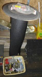Landscape fabric, a bunch of cut-off blades of 8 to 12 inch and tub of misc parts