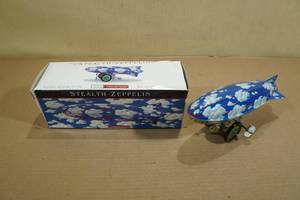 lot 245 image: Stealth Zeppelin Wind-Up Tin Toy