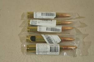 lot 295 image: 5 Lucky Shot 50 Cal Bullet Bottle Openers