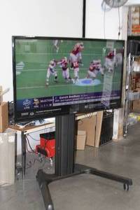lot 64 image: SEIKI Model SE65UY04 65 Class 4K Ultra HD 120Hz LED Television  TV  Display  Monitor on Rolling Stand