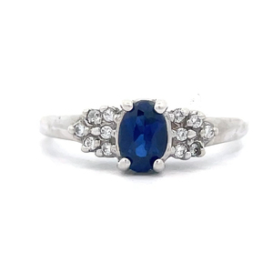 Oval Blue Sapphire & Sparkling Cubic Zirconia Cluster Ring in White Gold