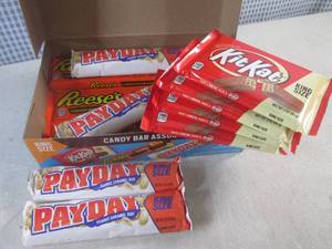 lot 290 image: (B-4) Box of 12 King Size Candy Bars 4 Each of Kit Kat, Pay Day and Reeses Peanut Butter Cups Best by Date Vary March - Aug 2024