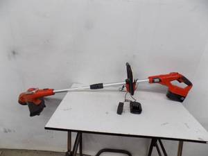 lot 134 image: Black & Decker Trimmer 24 v with charger