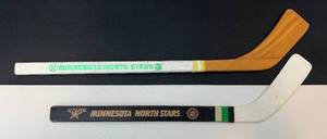 lot 181 image: Minnesota North Stars Vintage Mini Hockey Sticks