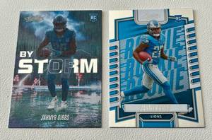lot 44C image: Lot of 2 Jahmyr Gibbs Rookie Cards - 2023 Absolute RC #108 23 Absolute RC By Storm #BST-8 - Football Cards