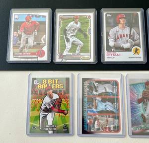lot 59C image: Lot of 9 Shohei Ohtani Baseball Cards - 2021 Bowman #85 21 Topps  #130 22 Topps #ASG-16 23 Bowman #51 23 Topps #SMLB-21 23 BL #200 23 BL #8B-3 24 Topps American League Leaders #179 24 Topps SMLB-21