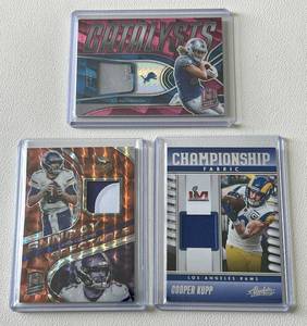 lot 154C image: Lot of 3 Patch Cards (2 Numbered) - 2023 Absolute Championship Fabric Patch Cooper Kupp #CF-1 20 Spectra Prizm Patch Kirk Cousins #21 410 22 Spectra Patch TJ Hockenson #CAT-TJH 1015
