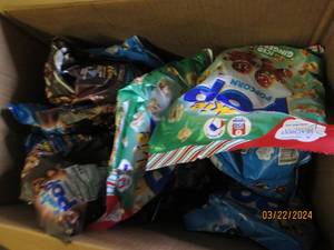 box of various flavor popcorn in date Best by 08232024