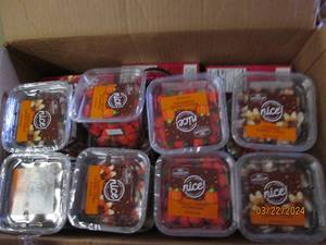 box of candy corn, candy pumpkins and more in date Best by 072025