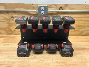lot 19 image: MILWAUKEE M12M18 Battery Holder (Batteries Not Included)