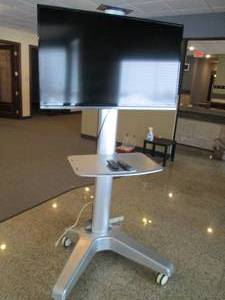 46 Sanyo flat screen TV and remote on heavy duty presentation cart with tray and locking wheels