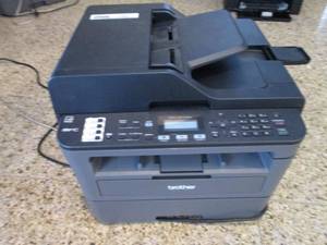 Brother MFC-L2710ODW PrintCopyFax machine with cords