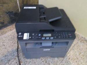 Brother MFC-L2710ODW PrintCopyFax machine with cords