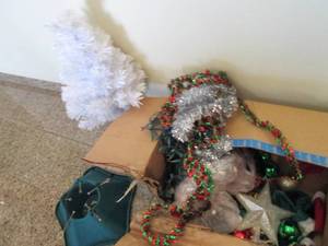 Artificial Christmas tree, real tree stand and other holiday decor