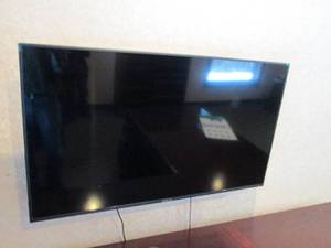 Sceptre 50 flat-screen TV with wall mount (buyer responsible to bring proper tools and removing from structure)