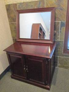 Dark wood free standing storage cabinet with Wood framed wall mount mirror