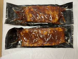 lot 77 image: A. 2x 2.20lbs St. Louis Style BBQ Pork Ribs