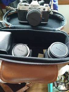 lot 110 image: Canon AE-1 35MM Camera With Case And 3 Lenses