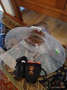 lot 223 image: 2 Adjustable Plastic Cones, Foot Brace, And Travel Bottle Sling