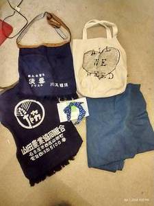 lot 286 image: Misc. Textiles Lot - 2 Asian Aprons, 1 Unbreakable Headband, Canvas Bag, And Large Piece Of Denim Fabric