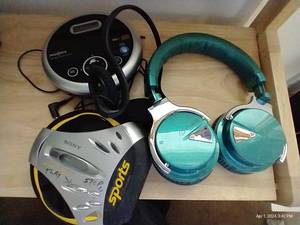 lot 300 image: Cowin Headphones With Sony Discman And Insignia Discman